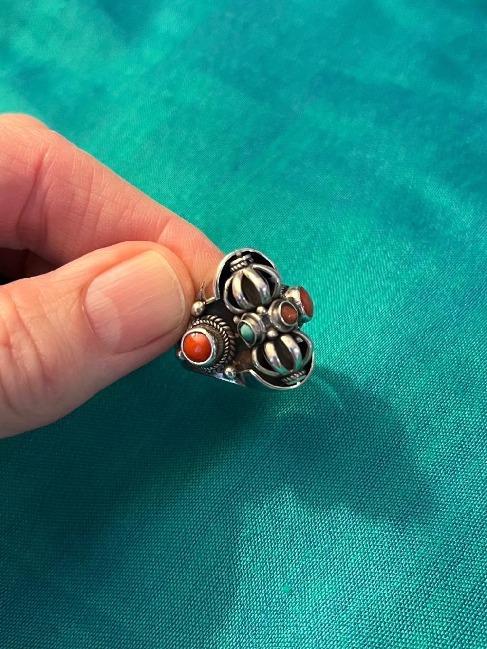 Sterling Buddhist spinner ring coral adjustable